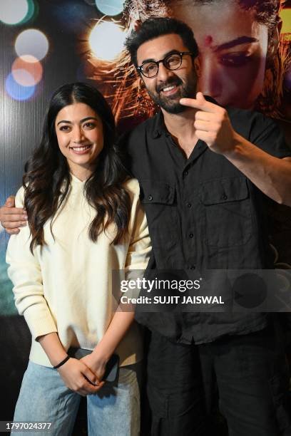 Bollywood actors Rashmika Mandanna (L) and Ranbir Kapoor attend the screening of their upcoming Indian Hindi-language action thriller film 'Animal' in Mumbai on November 22, 2023. (Photo by Sujit JAISWAL / AFP) (Photo by SUJIT JAISWAL/AFP via Getty Images)